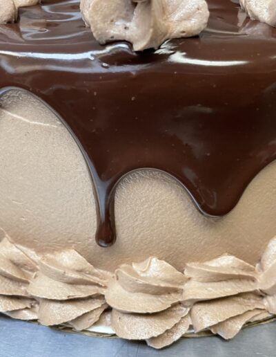 image of a cake with chocolate drip edge